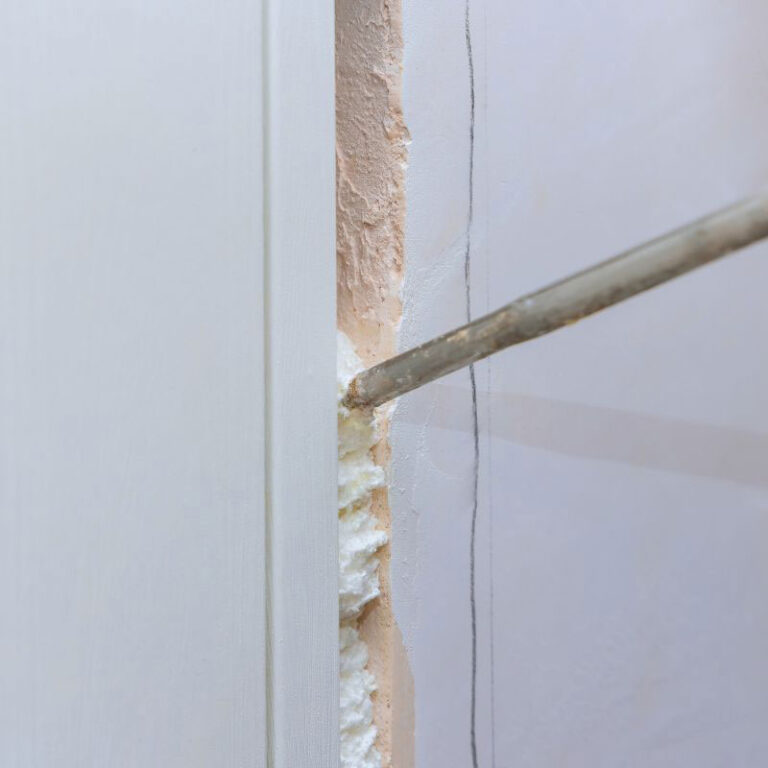 Topsen A1 PU foam being applied to fill gaps in a wall, providing insulation and airtight sealing